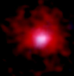 billede af en ung galakse omkranset af kulstof sky