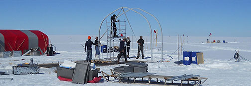 Taking down the drill tent skeleton. Slowly the ice cap surface is turning back to pre-RECAP conditions. In the background Jakobs setup at the shallow core drill site.