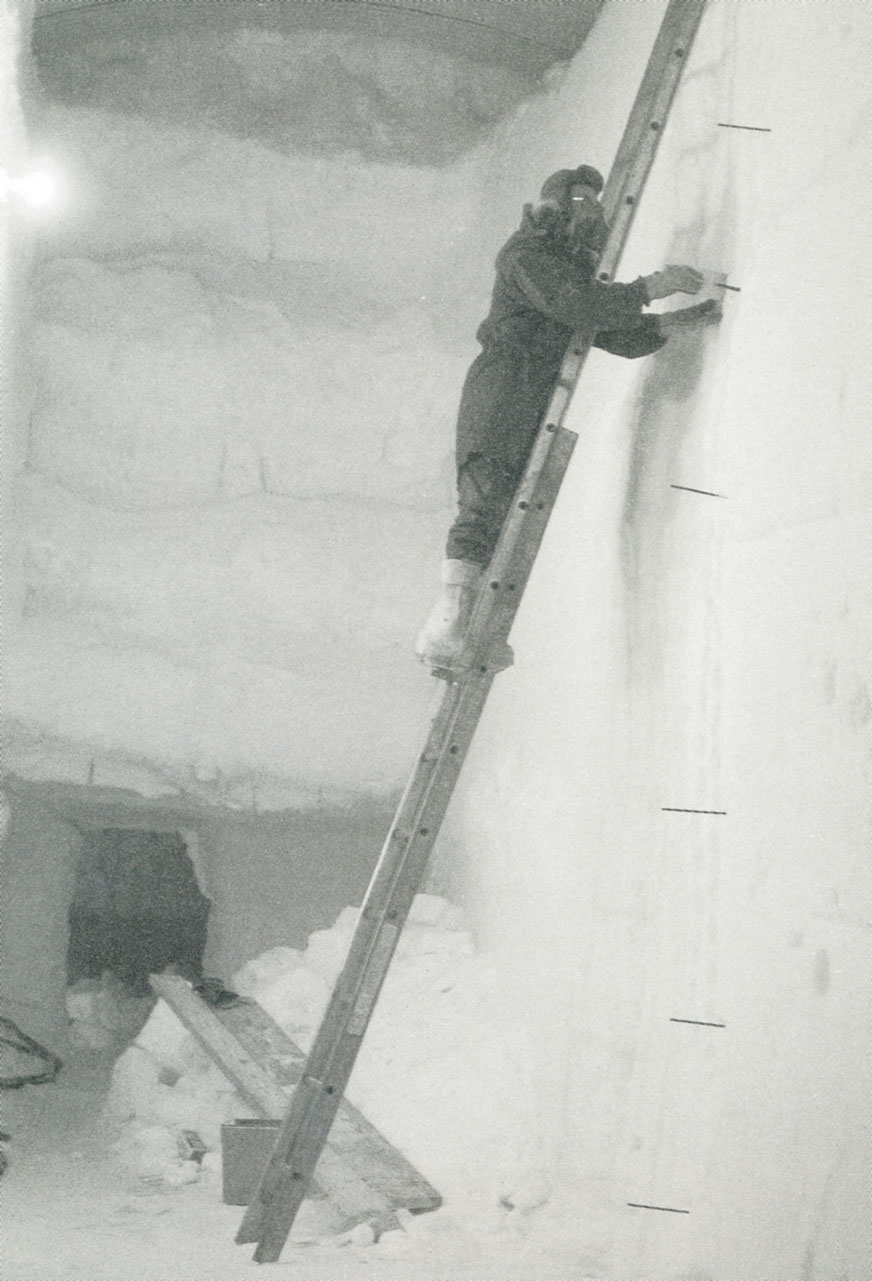 Willi Dansgaard taking samples from ice wall