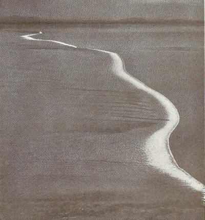 Luftfoto af tidevandet på en strand