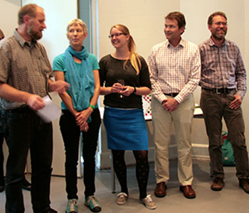 Helle Kjær (in the middle) together with the assessment committee. 