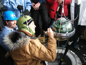 Detector getting lowered into the experiment