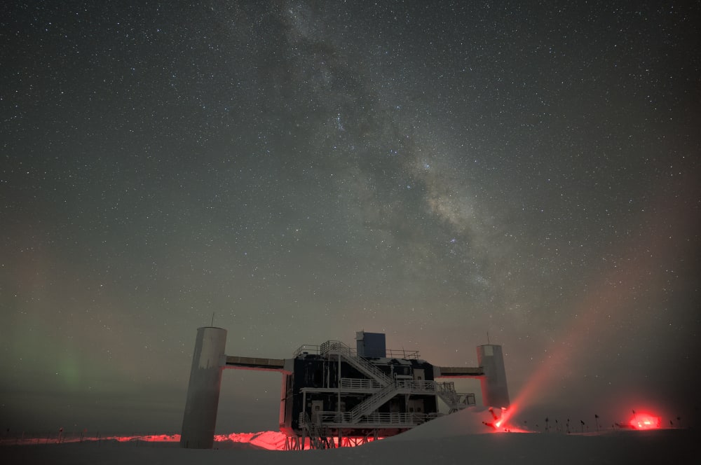 The IceCube Lab in May 2023 with a starry sky showing a glimpse of the Milky Way overhead. Credit: Marc Jacquart, IceCube/NSF