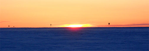 The sun almost sets at night over the northern end of the skiway.